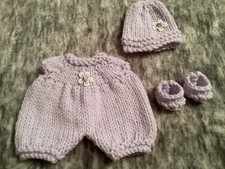Hand knitted dolls clothes to