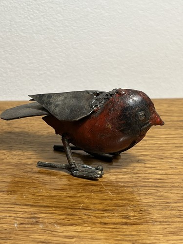 Robin red breast pecking metal - breast,