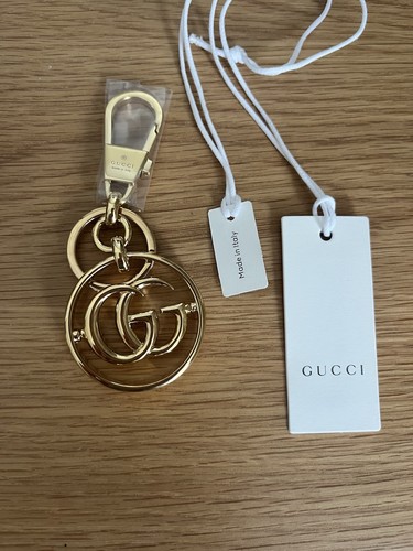 Gucci gold circular key - gold,