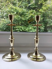 A Pair Of Brass Candle Sticks