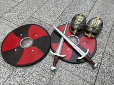 Two Sets Of  Children’s Viking Shields, Swords And Helmets