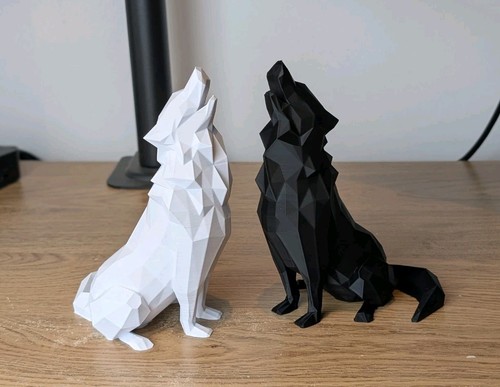Pair howling wolf statue - of,