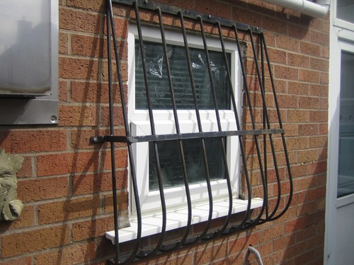 Wrought iron window - window, grill.