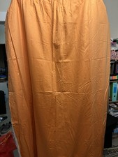 Pair of orange curtains, with