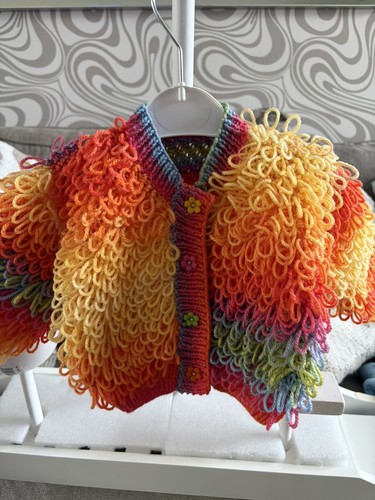 Hand knitted baby loopy - hand,