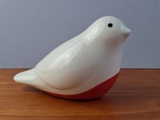 small white and red ceramic