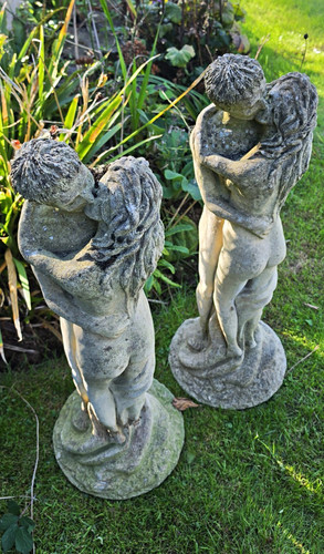 Pair grey cast composition - of,