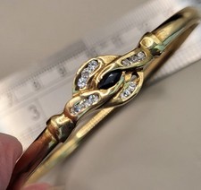 9ct Gold Blue & White Sapphire Bangle Bracelet. 8.3 grams. Ref: xaged.