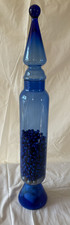 A TALL BLUE GLASS DECORATION/VASE/CONTAINER