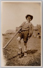 Young Boy Carrying a Large