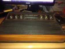 ATARI 2600 woody video computer system console + joysticks and paddles untested