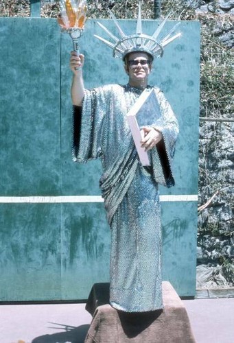 Elton john wears statue of - john,