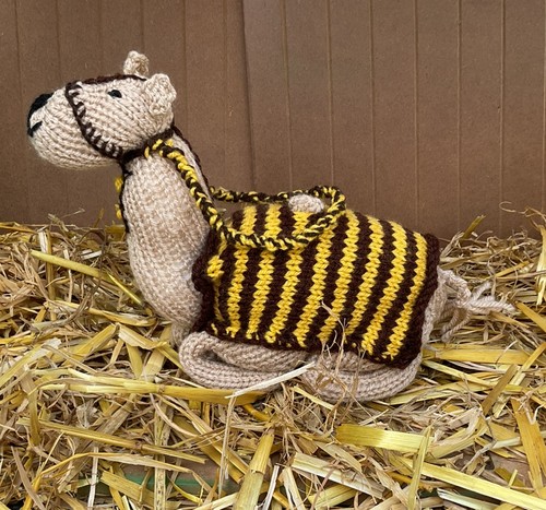 Hand knitted adult camel with - hand,