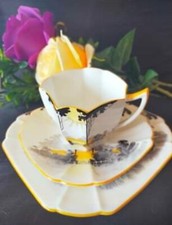 Shelley Queen Anne shape tall trees and sunrise