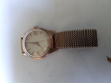 gold toned MuDu watch.working