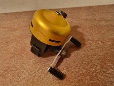 A GOOD USED VINTAGE ABU ABU-MATIC 110 CLOSED FACE BAITCASTING REEL