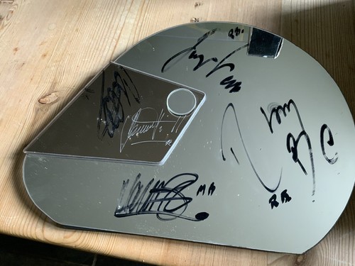 Helmet shaped mirror signed - shaped, by