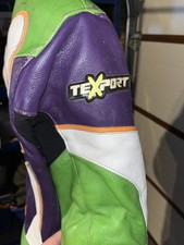 Green and purple race leathers