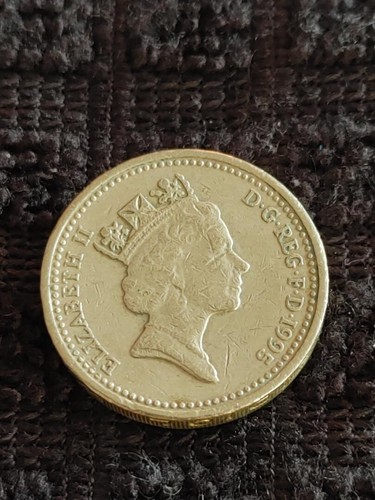One pound coin - one,