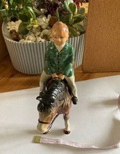 Ceramic A young child riding