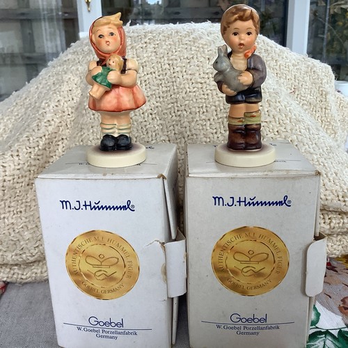 Two hummel figurines boxed my - two, boxed.