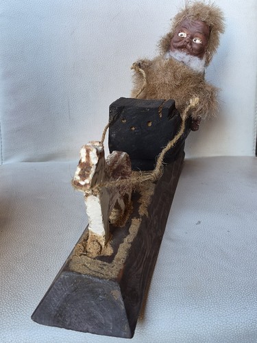 Eskimo man wood sled with - man,