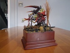 Warhammer 40k Tyranids Carnifex Plastic Well Painted on a wooden plinth.