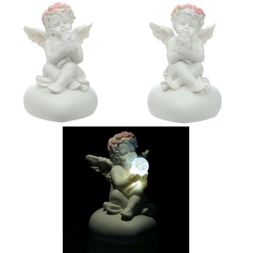 Sitting cherub holding - sitting, an