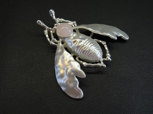 Matt silver brooch beetle - of, a