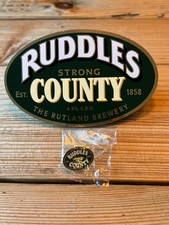 RUDDLES " STRONG COUNTY " beer pump clip & Pin badge Rutland brewery