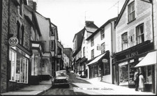 Knighton, Powys - High Street, shops, old car - Frith RP postcard c.1960s