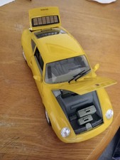 YELLOW BURAGO PORSHE CARERRA 911 (1993) DIECAST MODEL 1:18 SCALE