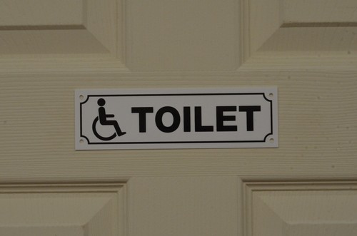 Disabled toilet sign - sign, or