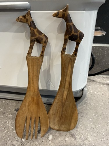 Hand carved wooden giraffe - hand,