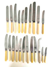 A selection of 22 Faux Bone Handle Cutlery Items Various Makes.