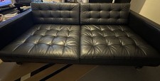 Three-seater black leather sofa Landskrona 