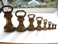 Run of 8 Antique Brass Weights. 7ib down to 1oz