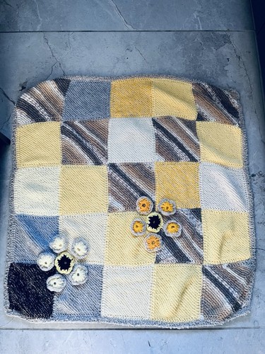 Hand knitted baby blanket.