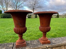 Rusty cast iron campagna urns