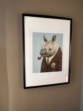 Framed Print Of Rhino With Pipe In Black Frame 