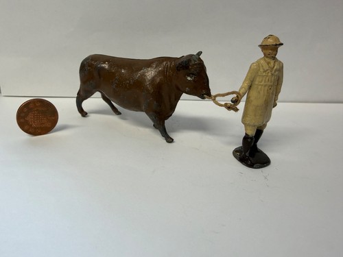Britains farmer leading bull - farmer,