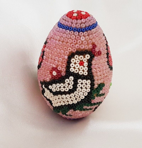Egg beaded design - on, wood