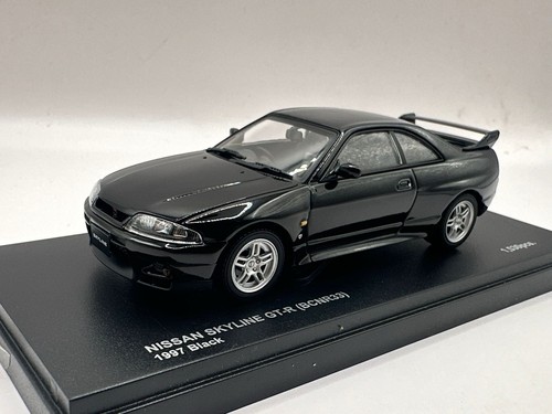Kyosho black 1997 nissan - 1/43,
