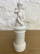 Alabaster Cupid Sitting on a Plinth Figurine