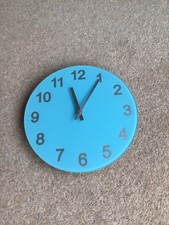 light blue and silver battery operated wall clock used 25cm diameter