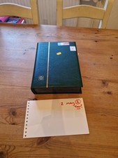 Stamp albums with stamps - with,