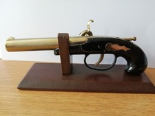Vintage Flintlock Lighter on wooden stand untested.