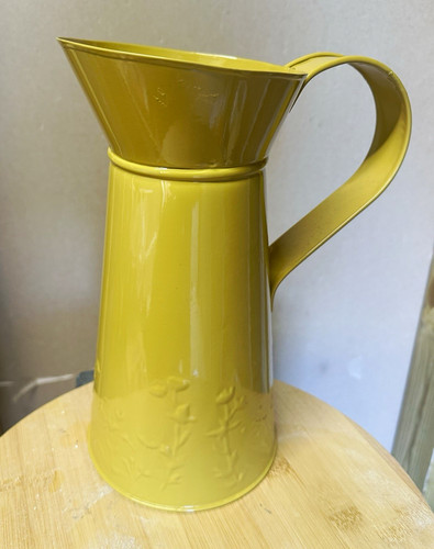 Yellow metal jug with - yellow,
