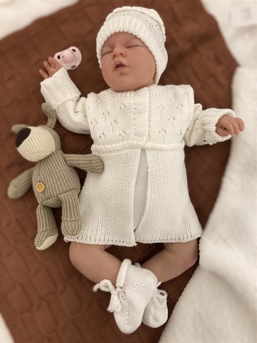 Hand knitted baby - hand,