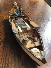 Handmade Wooden Rowing Boat with Sailor Figure.